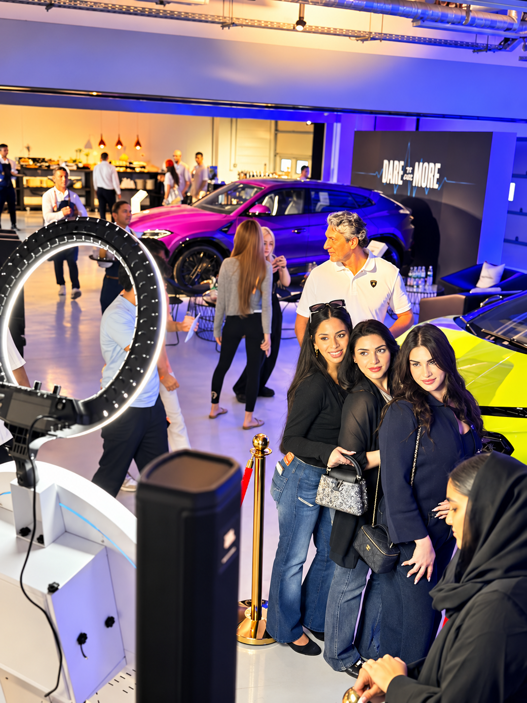 Guests interacting with the Sleek Arc Magic Mirror Photobooth at the Lamborghini event at Yas Marina Circuit Abu Dhabi