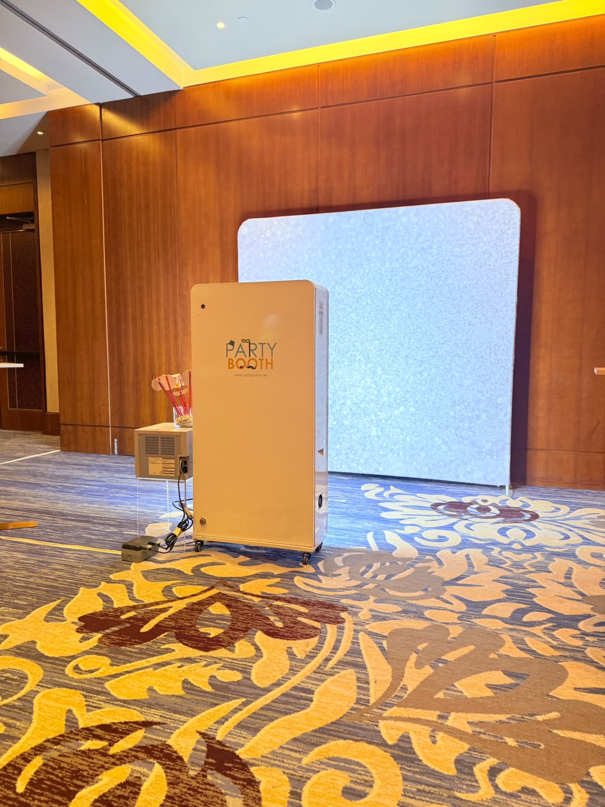 PartyBooth white photobooth kiosk and premium backdrop at Rosewood Hotel Abu Dhabi wedding